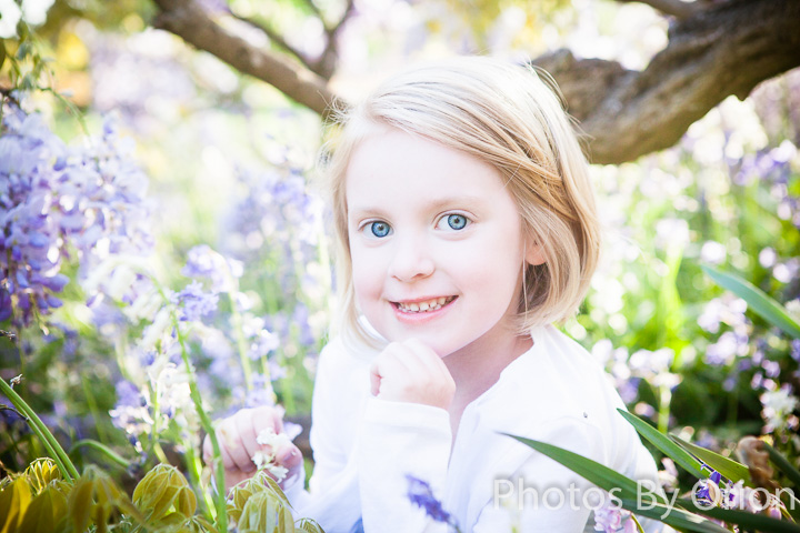 Child's specialty portrait at Bush Pasture Park under blooming tree